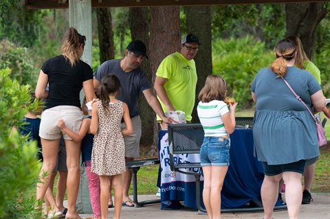 Parents at registration desk at a park