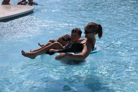 Splash into Summer mother and son in inner tube.