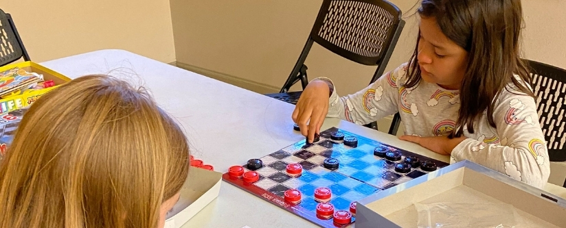 Children playing checkers