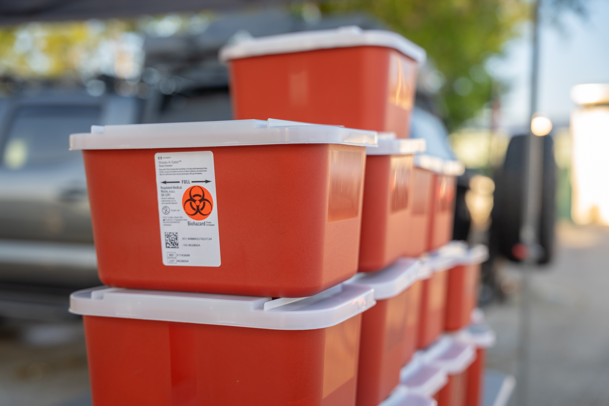 approved sharps disposal container